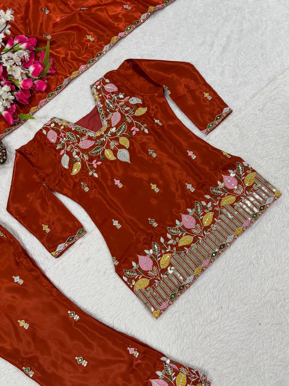 Elegant Rust Orange Silk Kurta and Flared Palazzo Set Adorned with Intricate Multicolored Botanical Embroidery and Mirror Work
